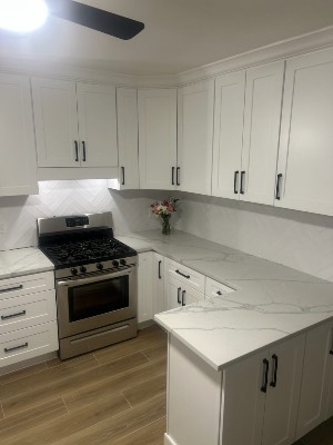 New white shaker kitchen cabinets with quartz counters by CJ Woodwork LLC