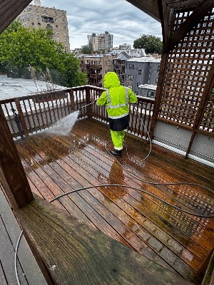 Pressure washing a wooden deck