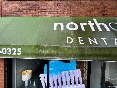 Close-up of a freshly cleaned storefront awning