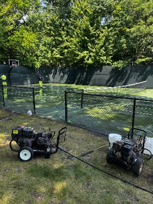 Pressure washing a tennis court