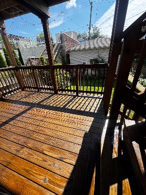 Restored back-porch deck in afternoon sun