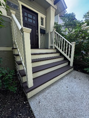 Front steps refinished with white railings