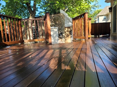 Freshly sealed backyard deck, still glossy