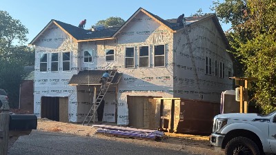 New home construction with house wrap installed