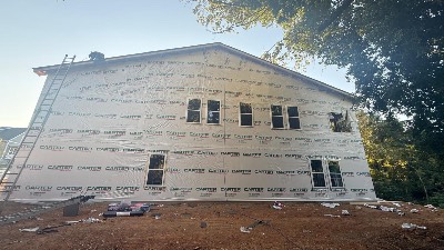 Side view of a new two-story home under construction