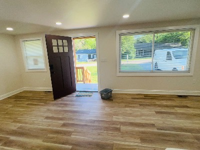 Renovated living room with new vinyl plank flooring
