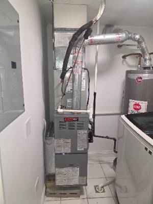Lennox furnace and ductwork installed in a utility closet