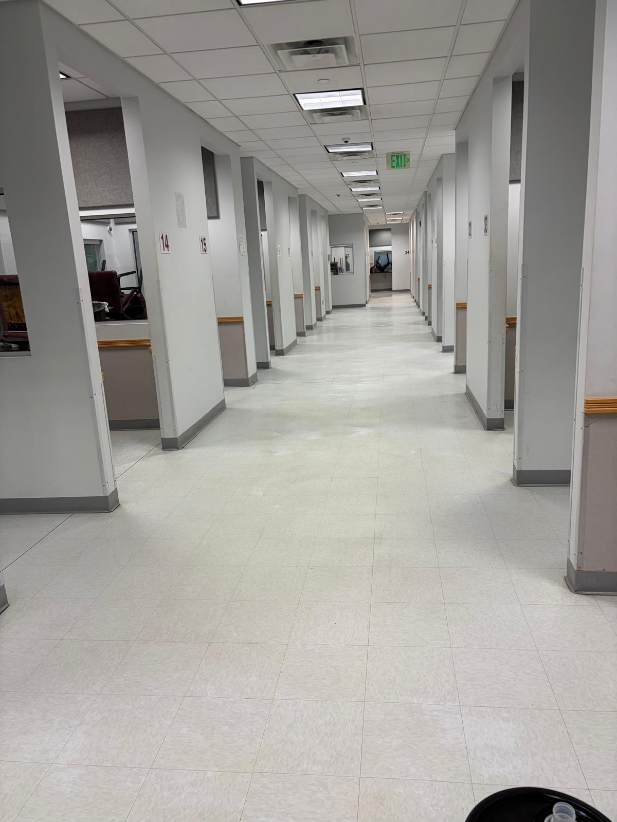 Commercial cleaning crew preparing workspace