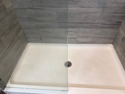Spotless white shower base and drain
