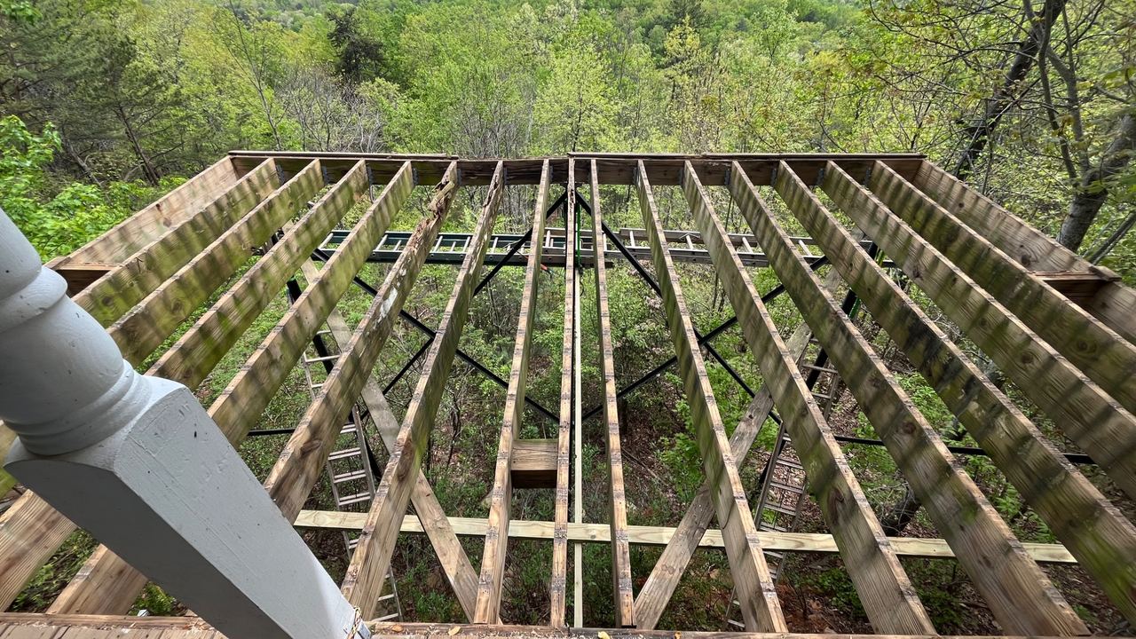 A deck framed out by Jireh Painting and Remodeling, joists down and ready for boards