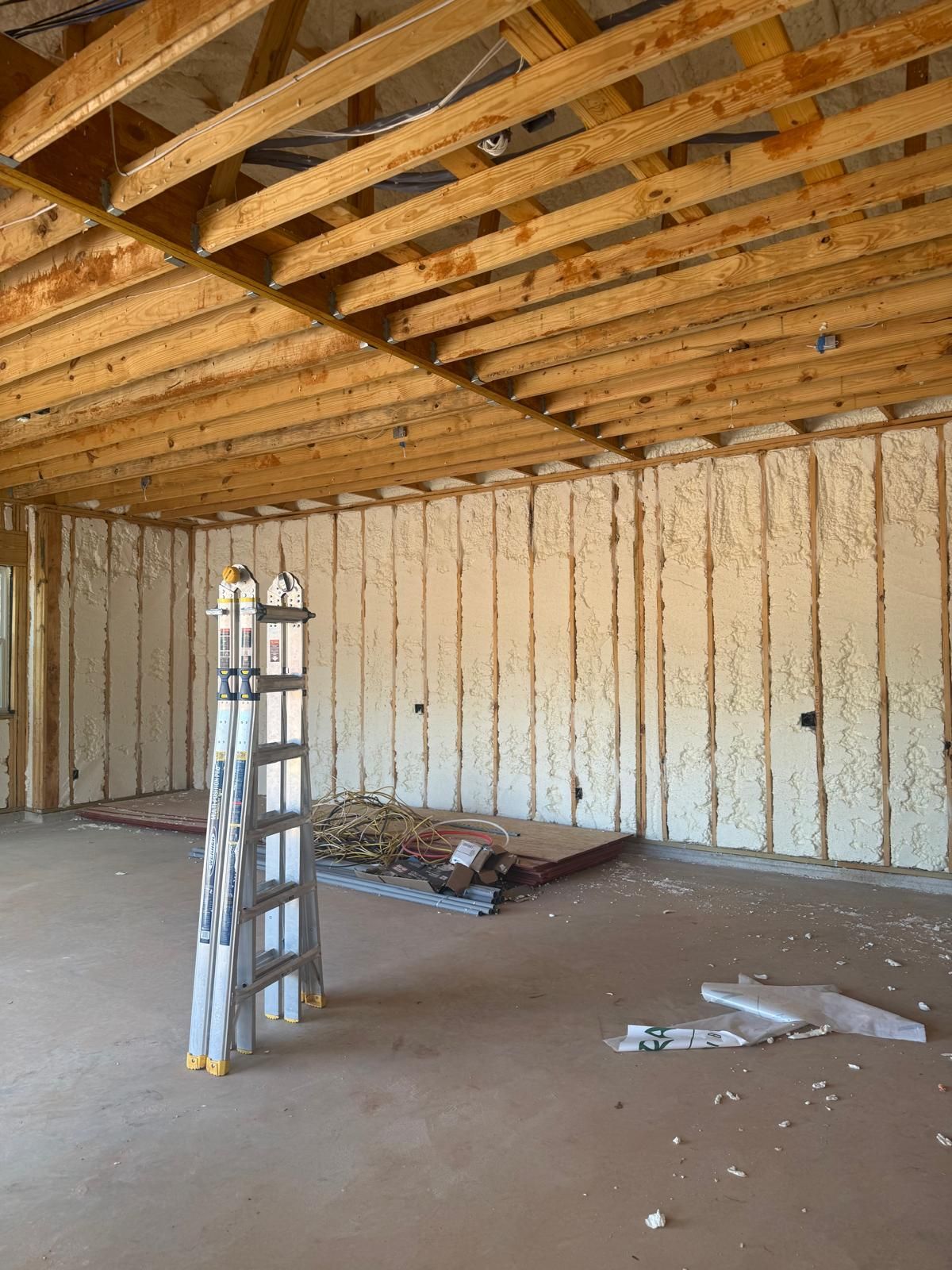 Spray foam insulation installed in the wall cavities of a new home by Allstar Insulation