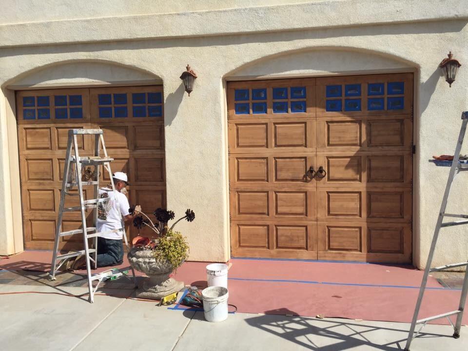 Garage doors refinished — before