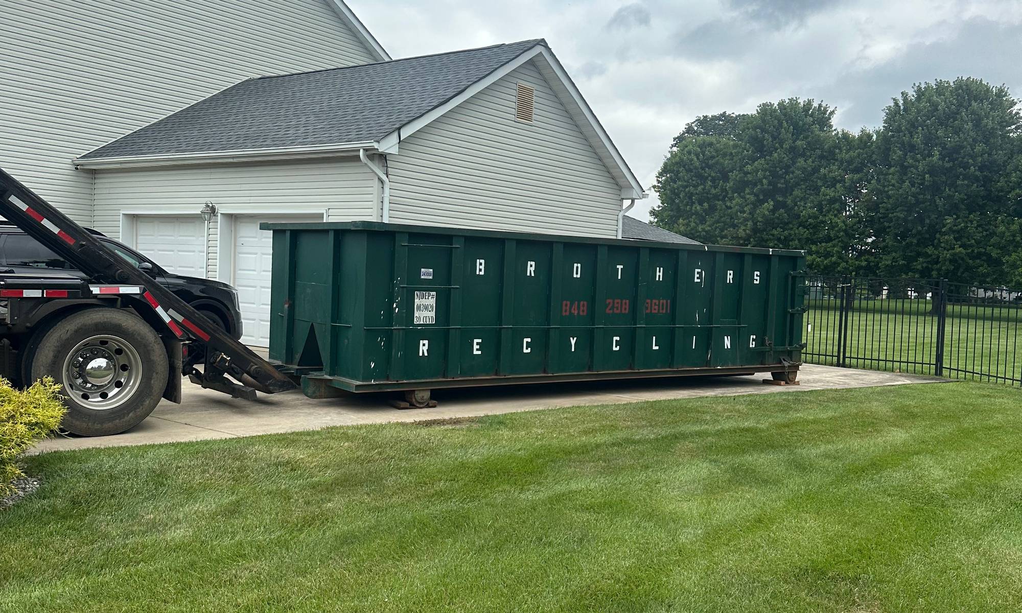 Roll-off container and cleanout work by Brothers Recycling LLC