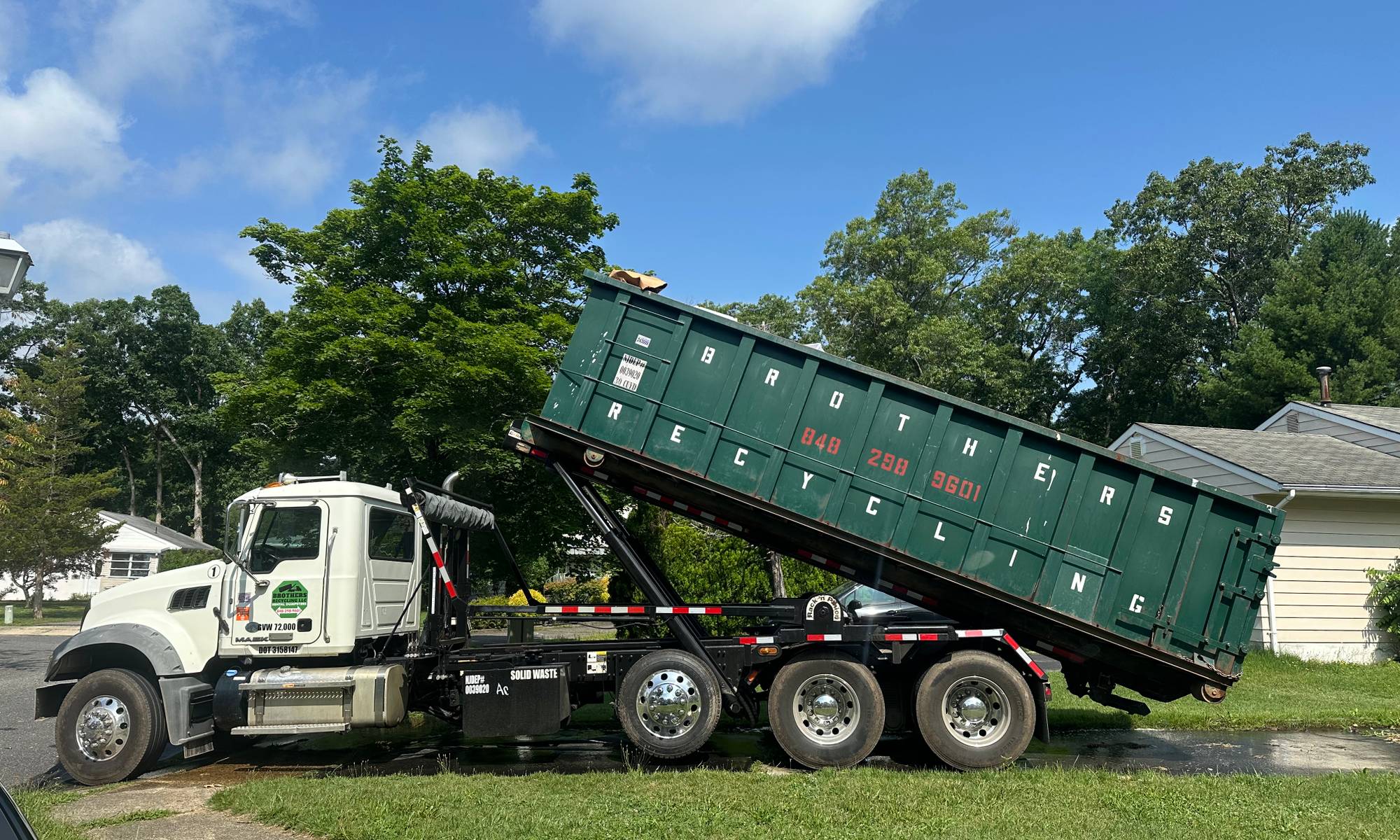 Roll-off container and cleanout work by Brothers Recycling LLC