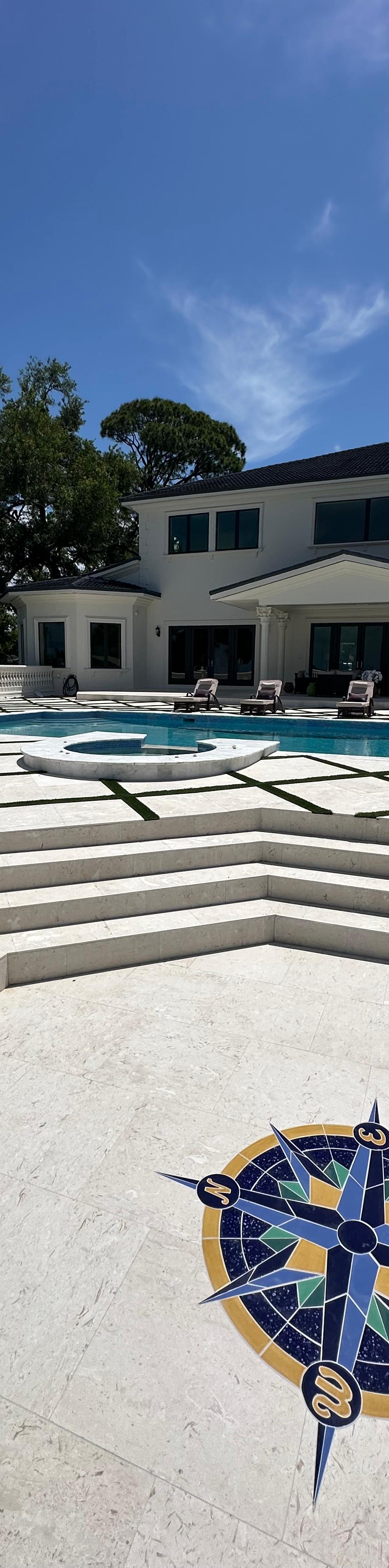 Travertine vs. Concrete Pool Decks: What Holds Up Best in Florida