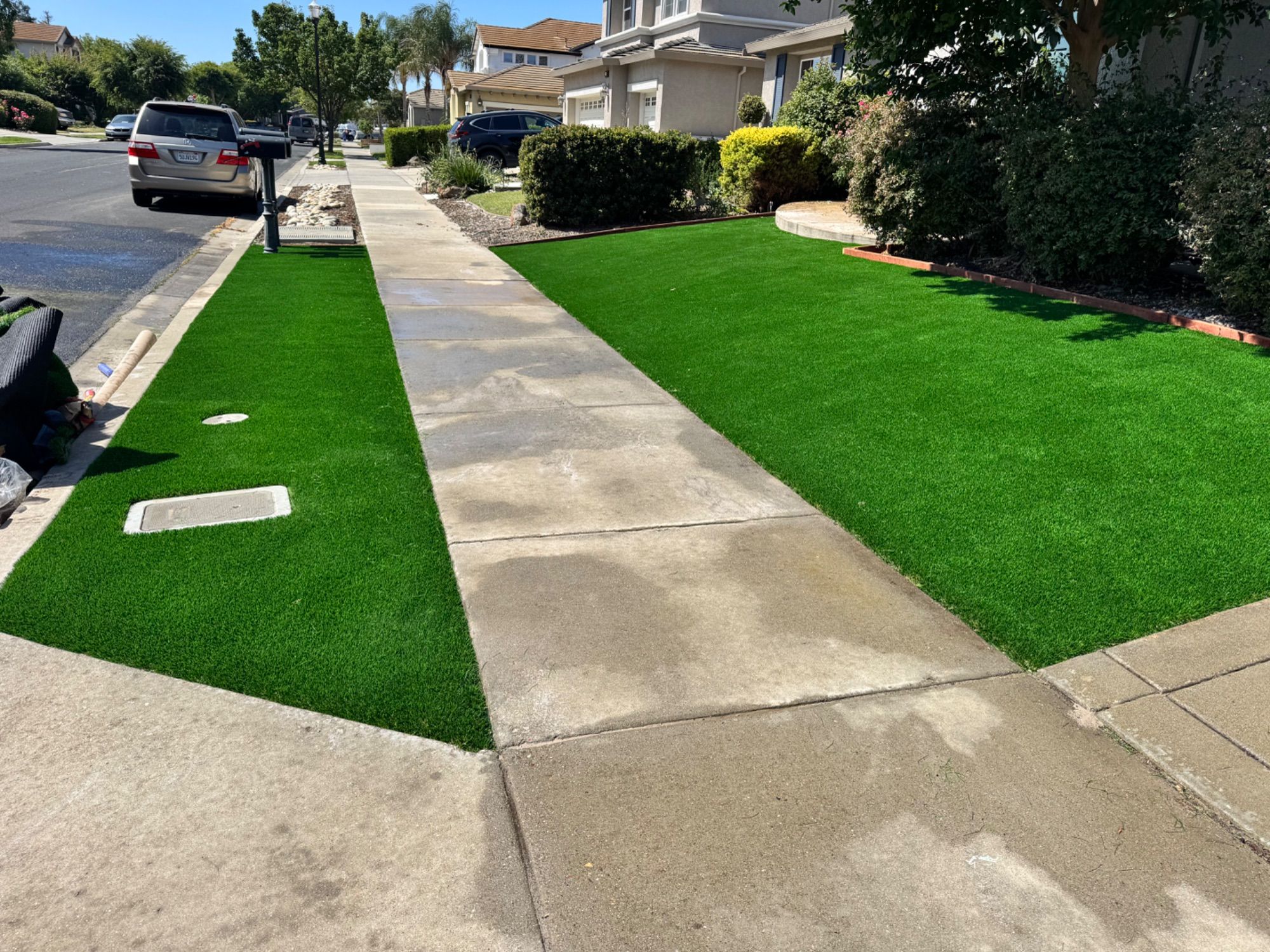 Front-yard artificial turf on both sides of a walkway