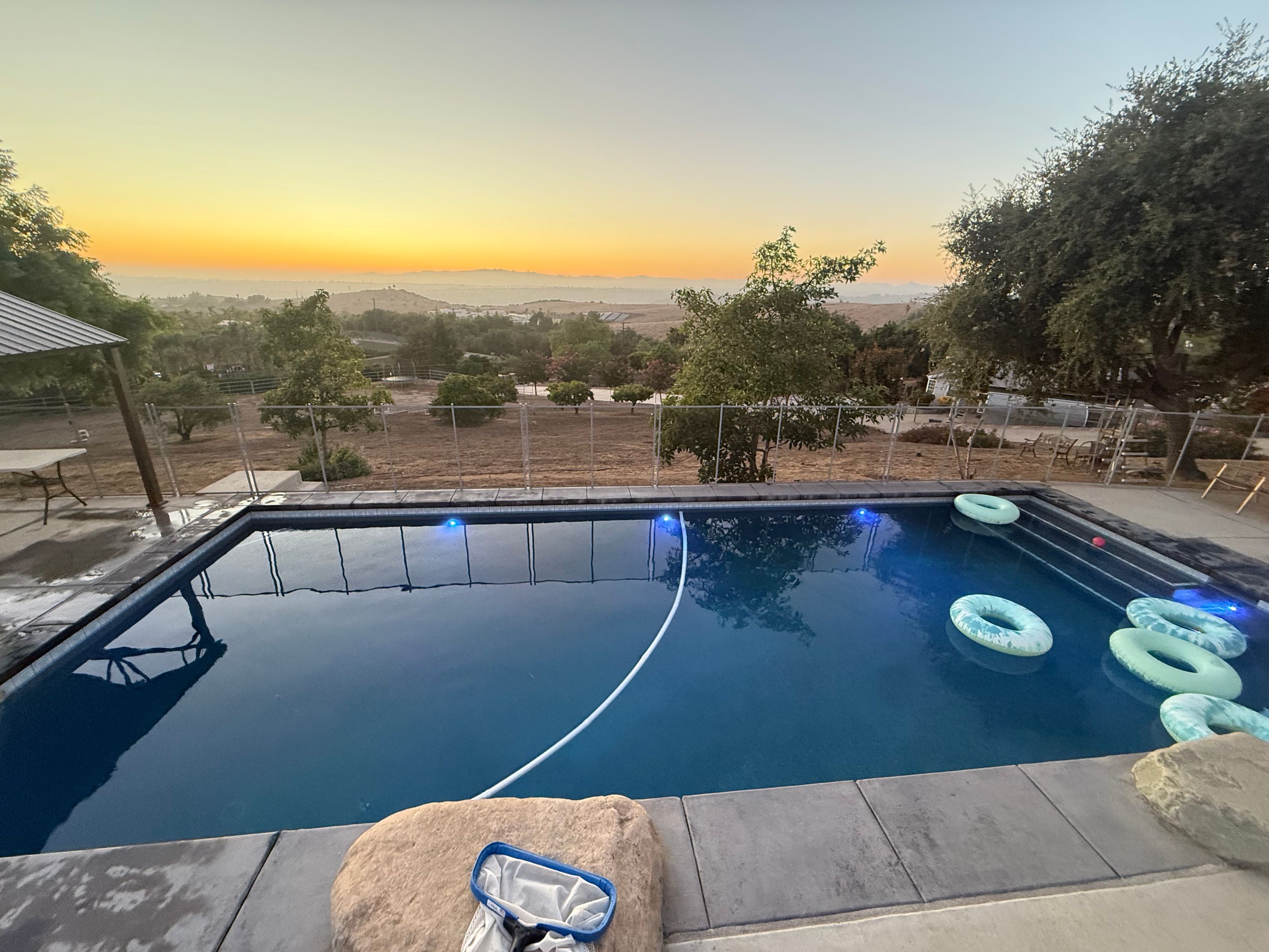 Backyard swimming pool at sunset in North San Diego County