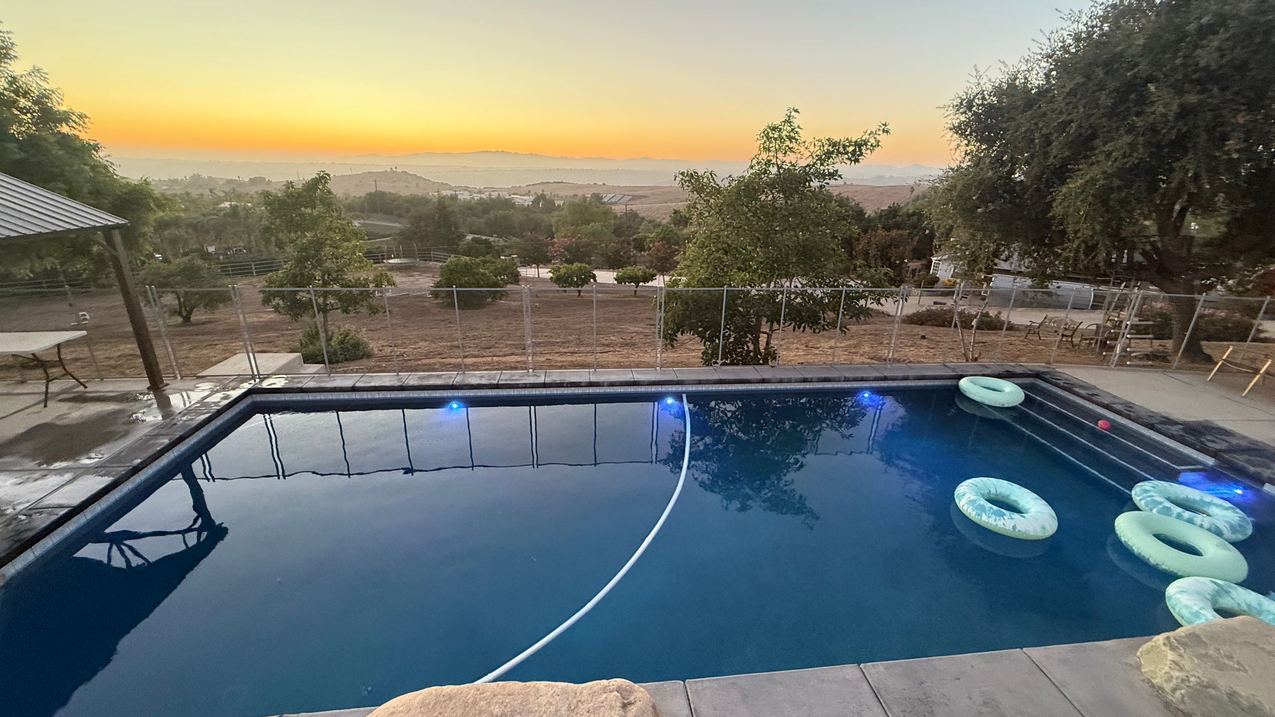 Backyard swimming pool at sunset in North San Diego County