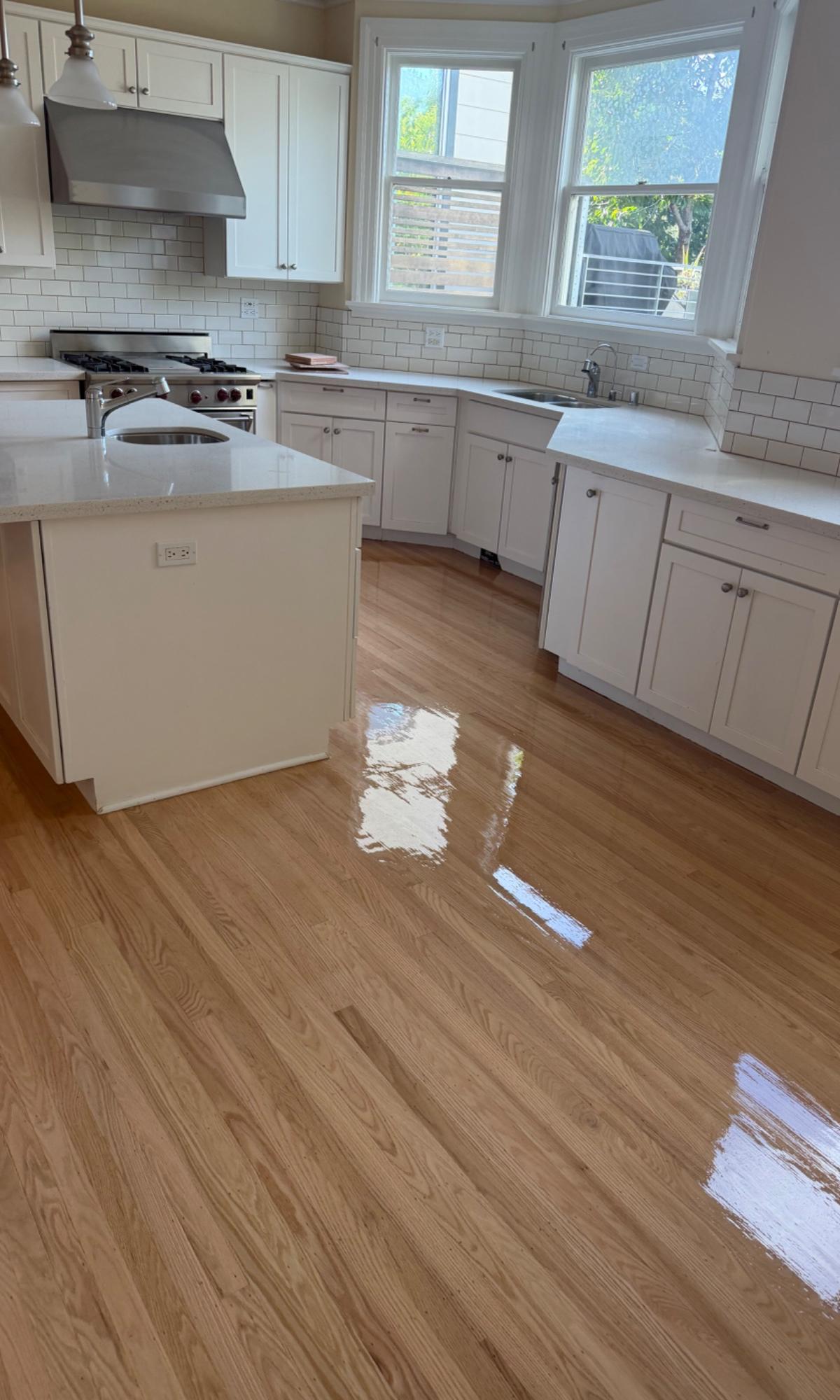 Freshly refinished hardwood floor in a San Francisco kitchen