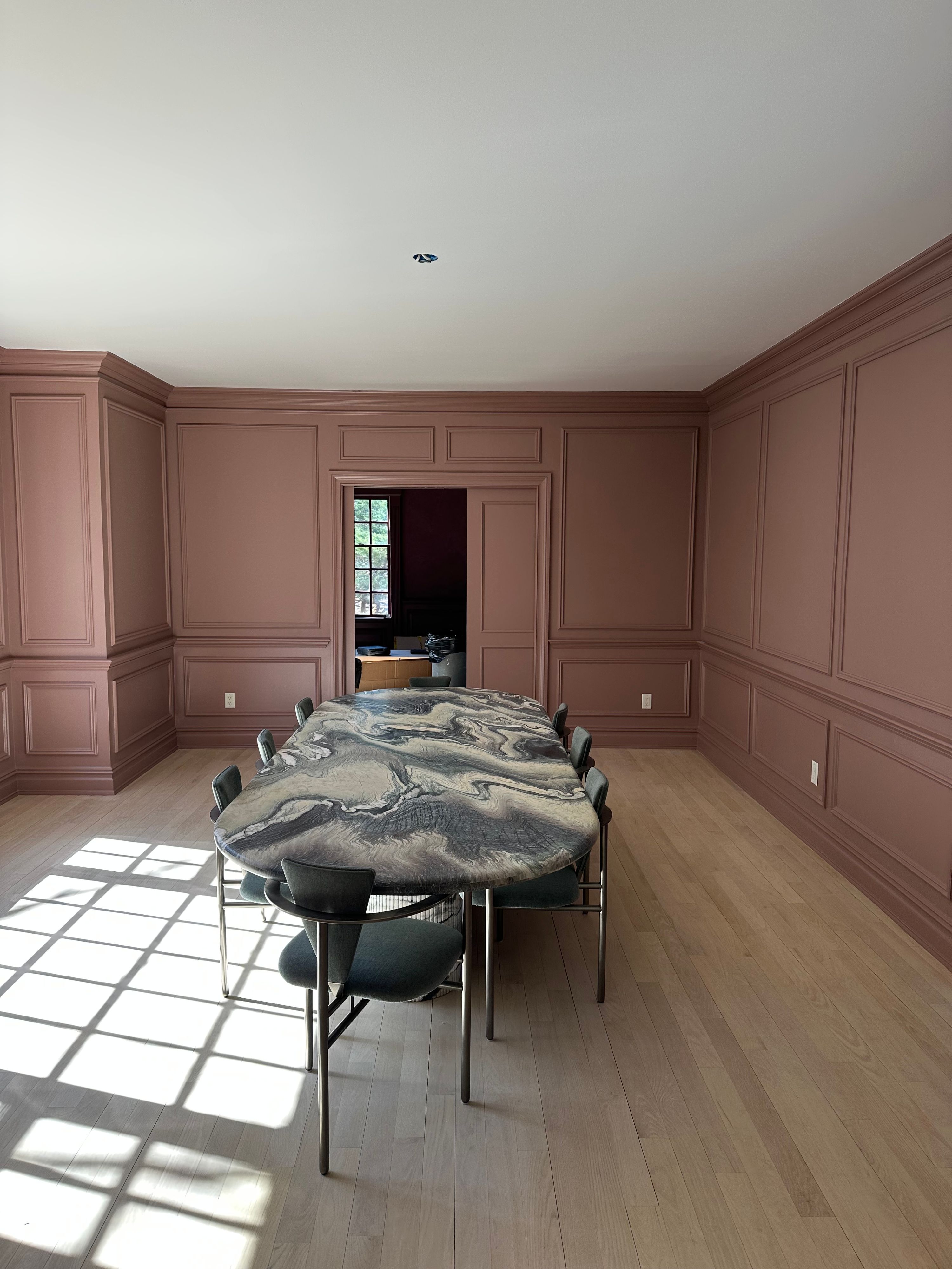 Dining room in dusty pink with panelled wainscoting and white trim — FE Pro Painting