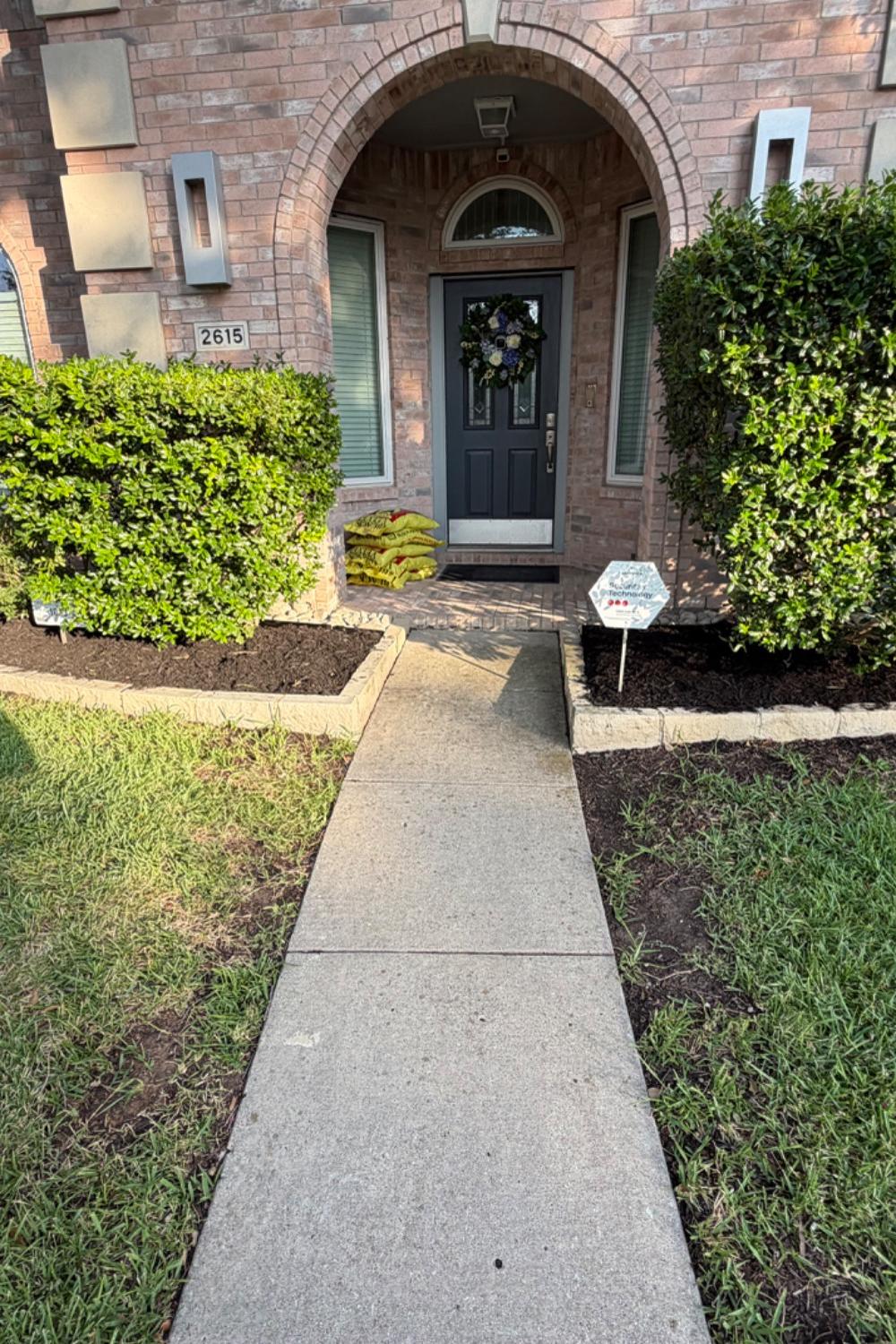 Front yard with freshly mowed lawn and crisp, clean edges