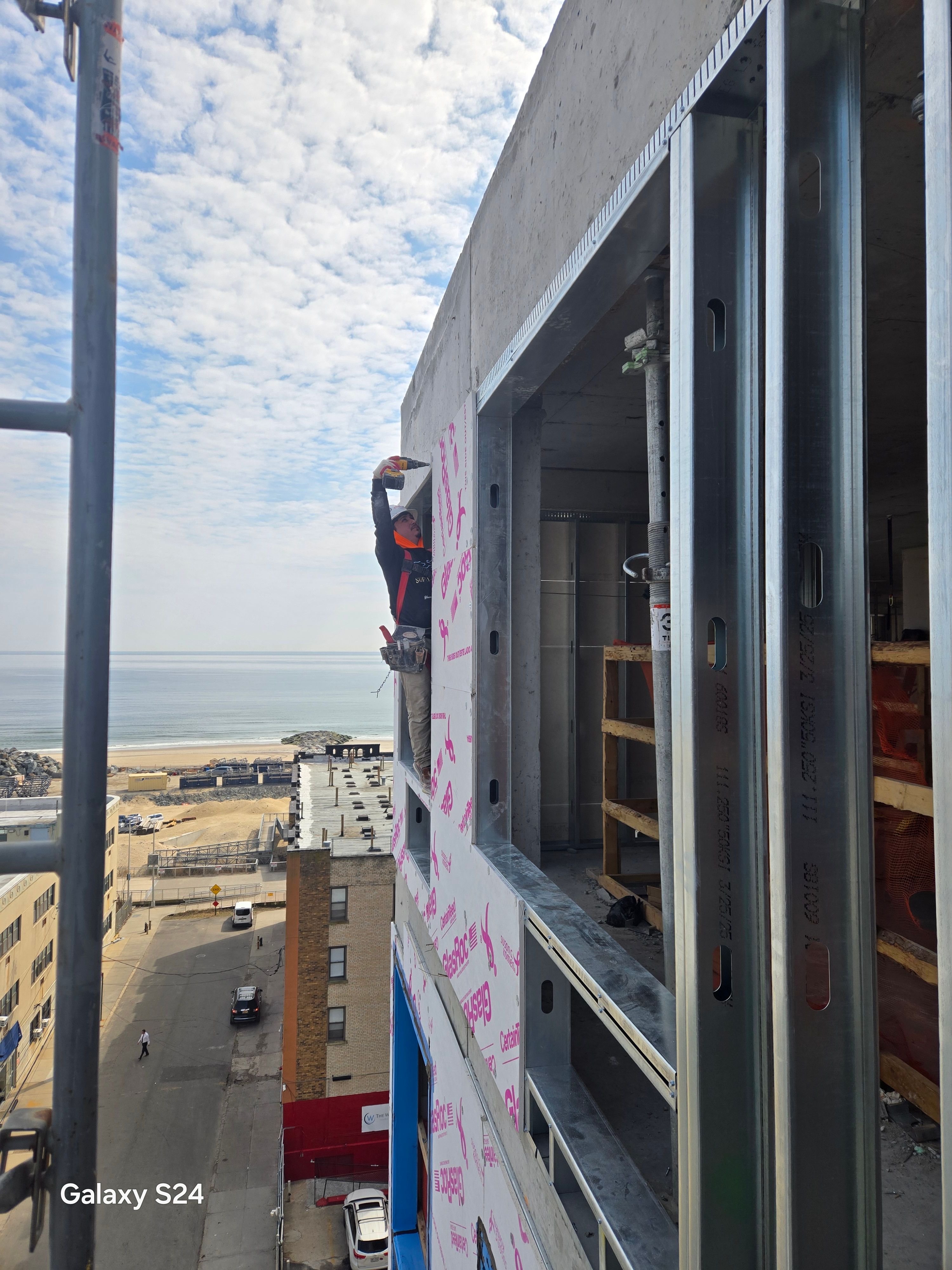 GRKremodeling LLC crew installing exterior sheathing on a New York building