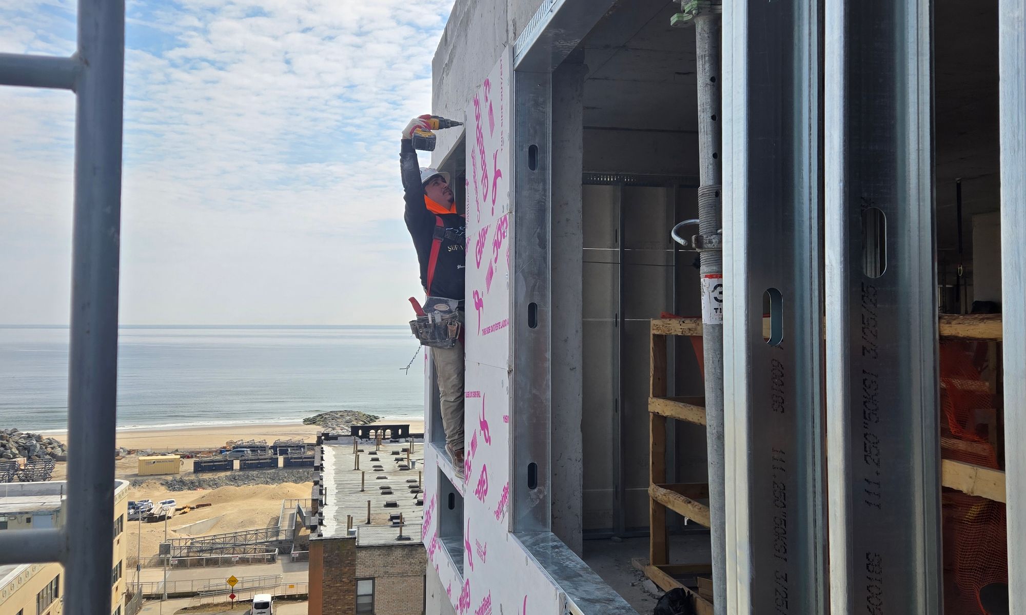 GRKremodeling LLC crew installing exterior sheathing on a New York building