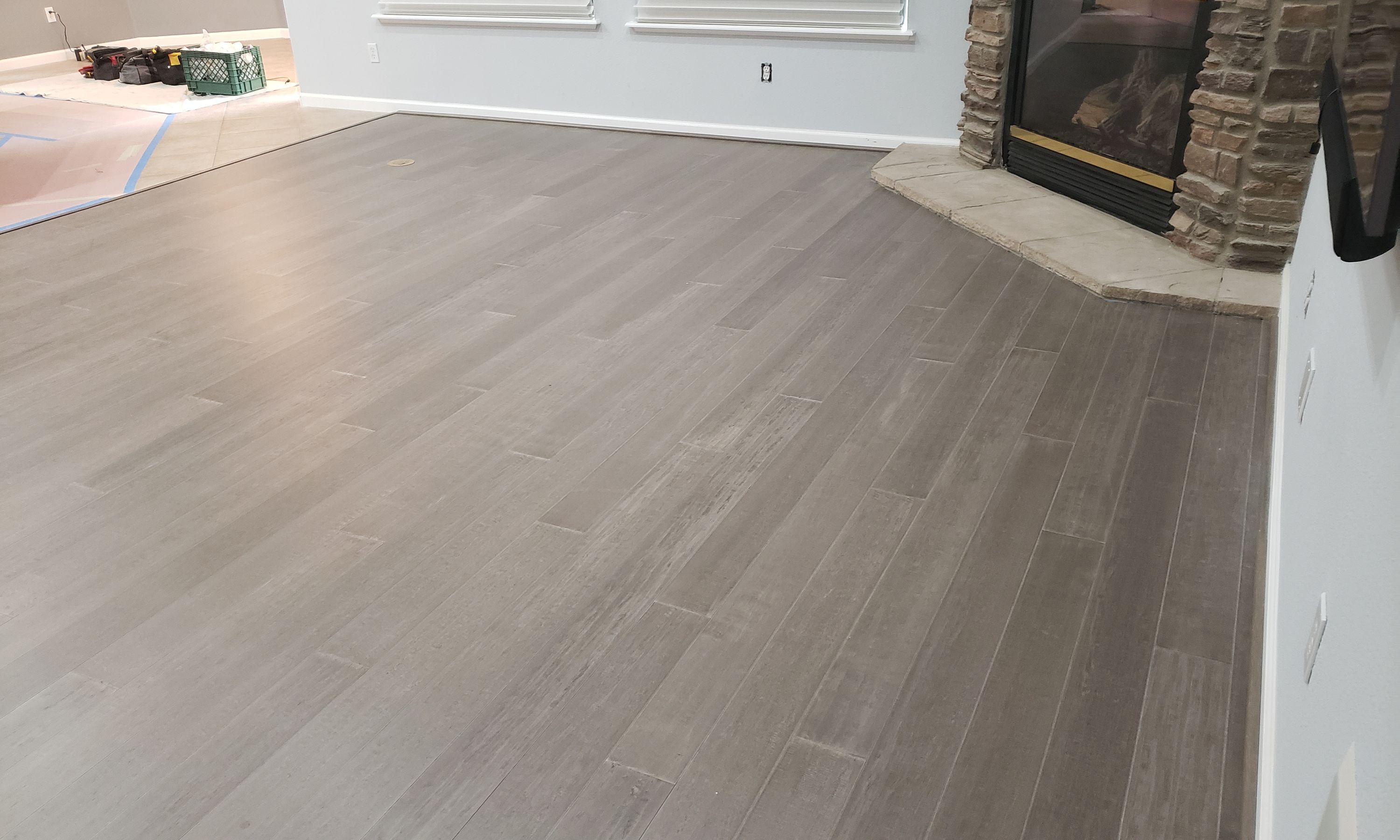 Grey wide-plank flooring installed by Heavenly Floors, Inc. in a California living room