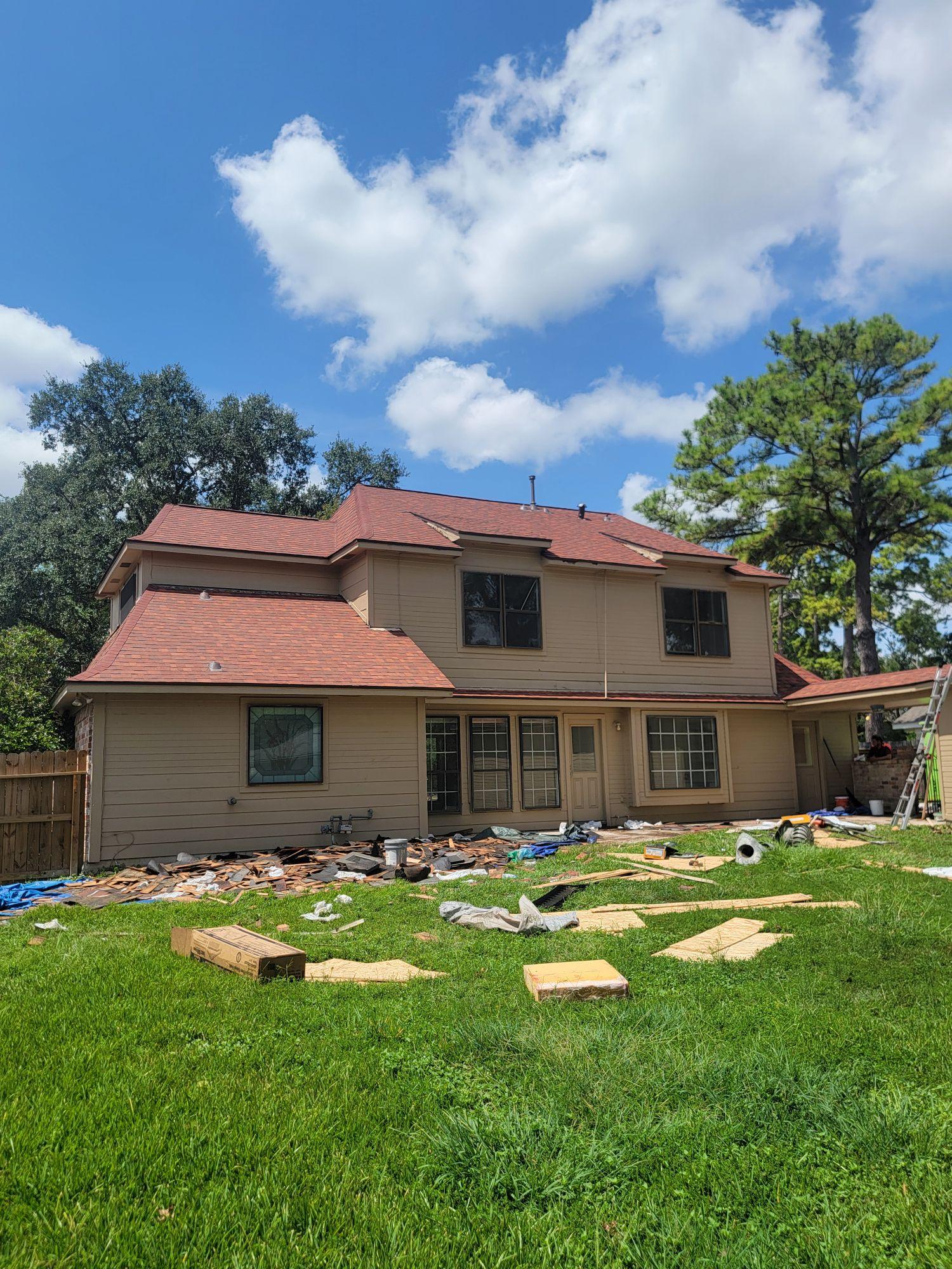 Two-story Houston home with a new shingle roof installed by A to Z Remodeling