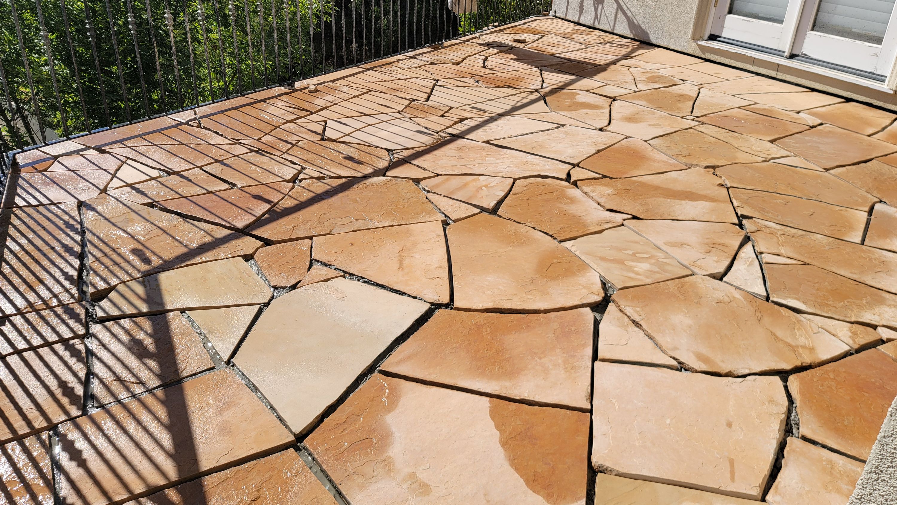 Flagstone paving with sand-coloured grout joints
