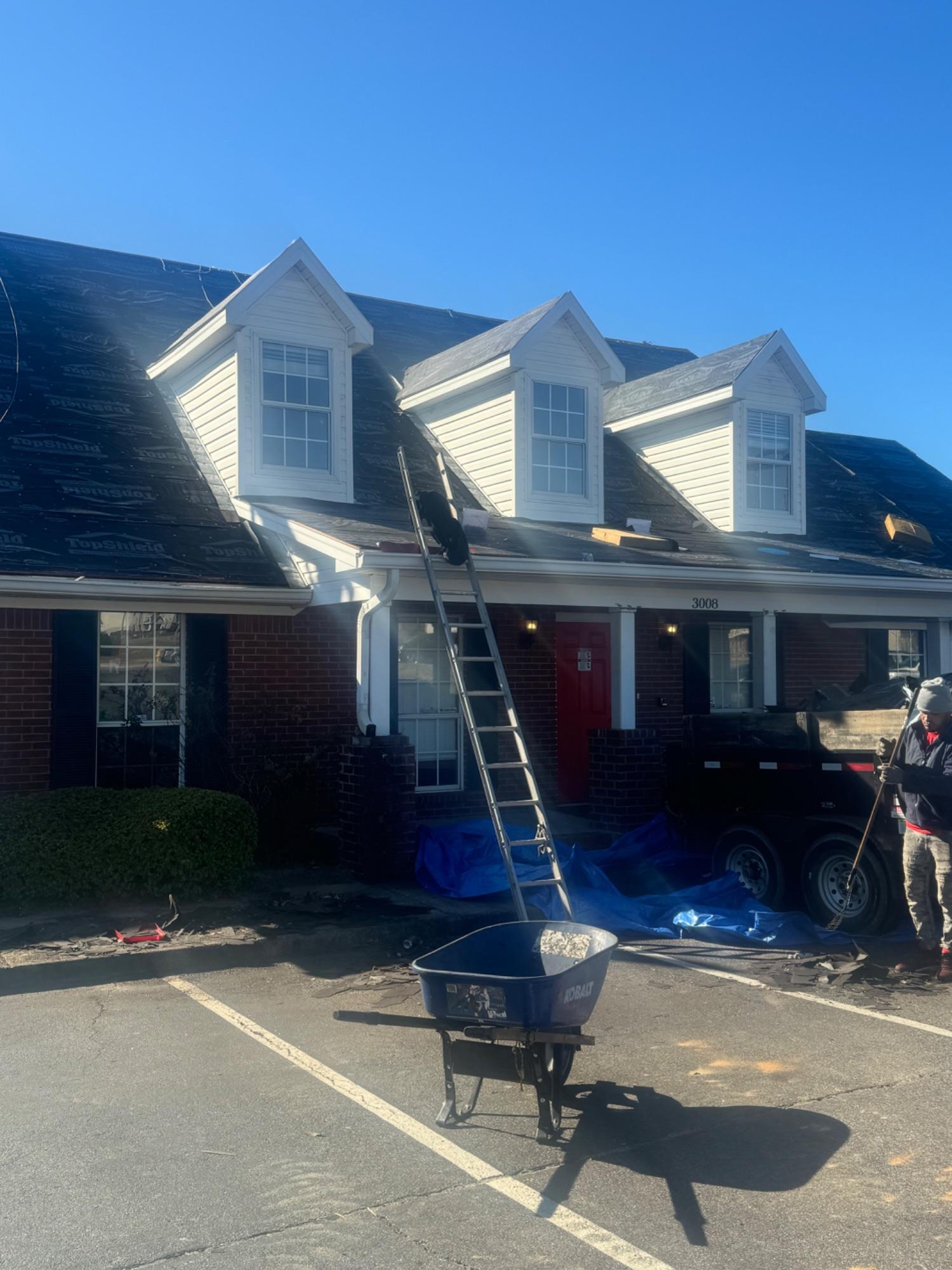 Hyperborean Contracting crew re-roofing a two-story home in the Columbia area