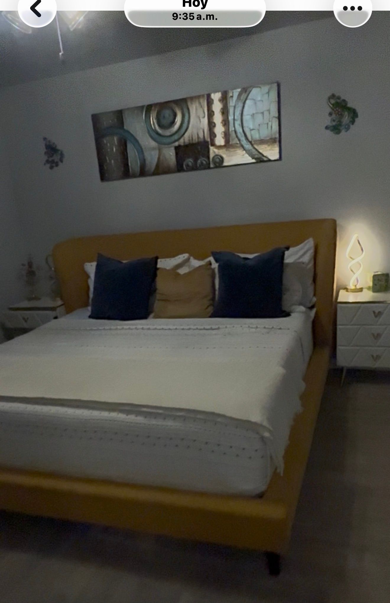 Neatly made bedroom after a professional home cleaning visit