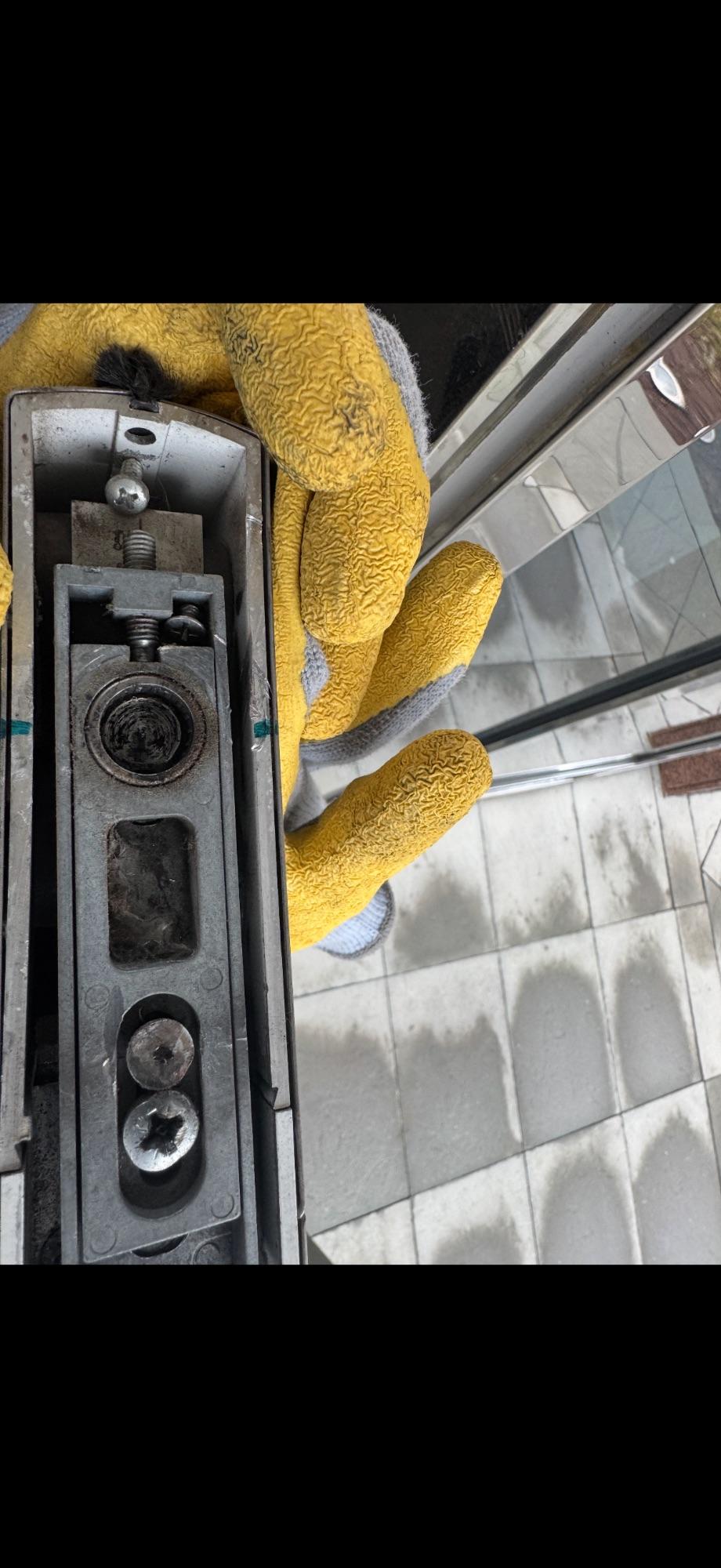 JCA technician adjusting a glass door pivot