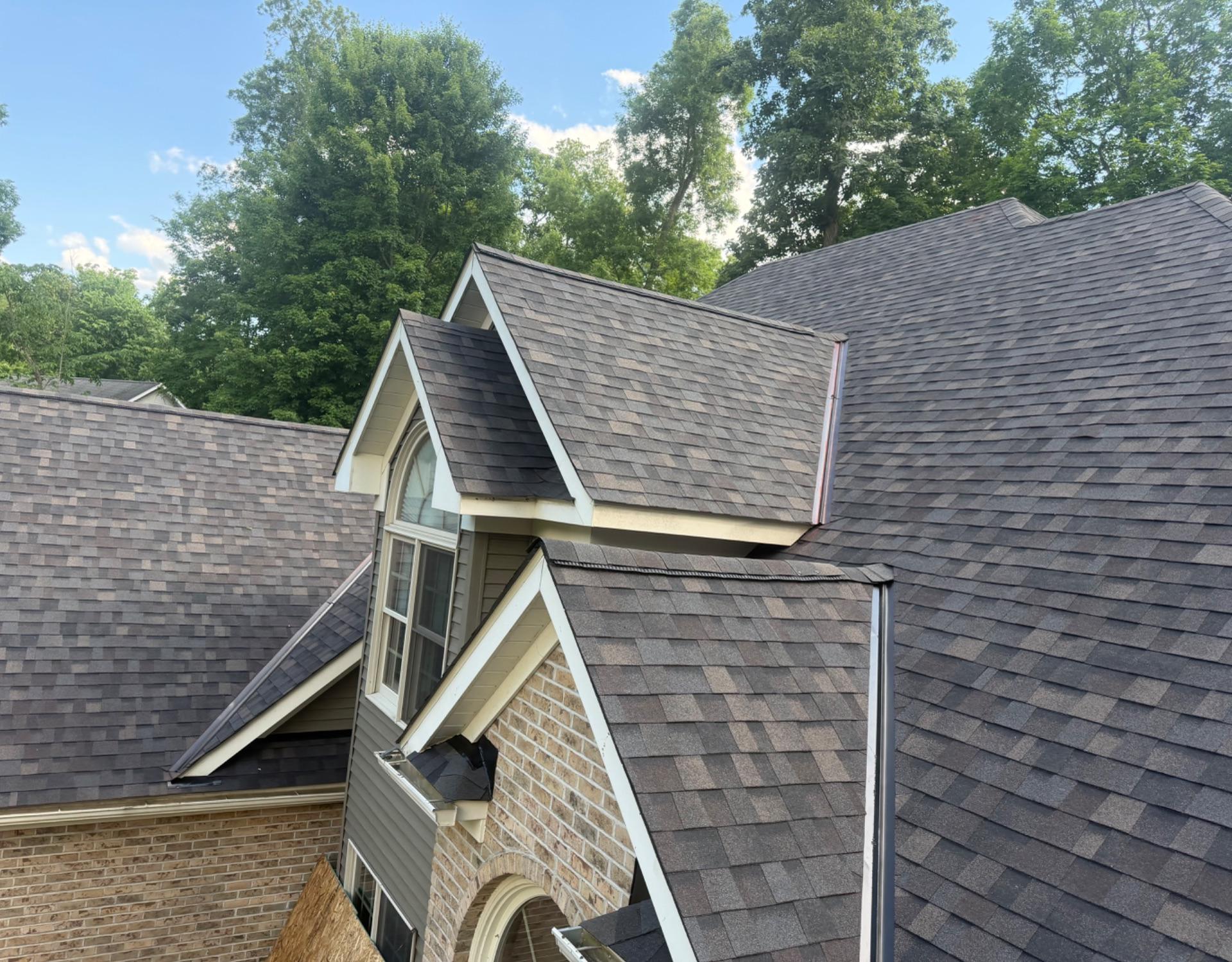 New shingle roof with a gabled dormer, finished by L&J Roofing