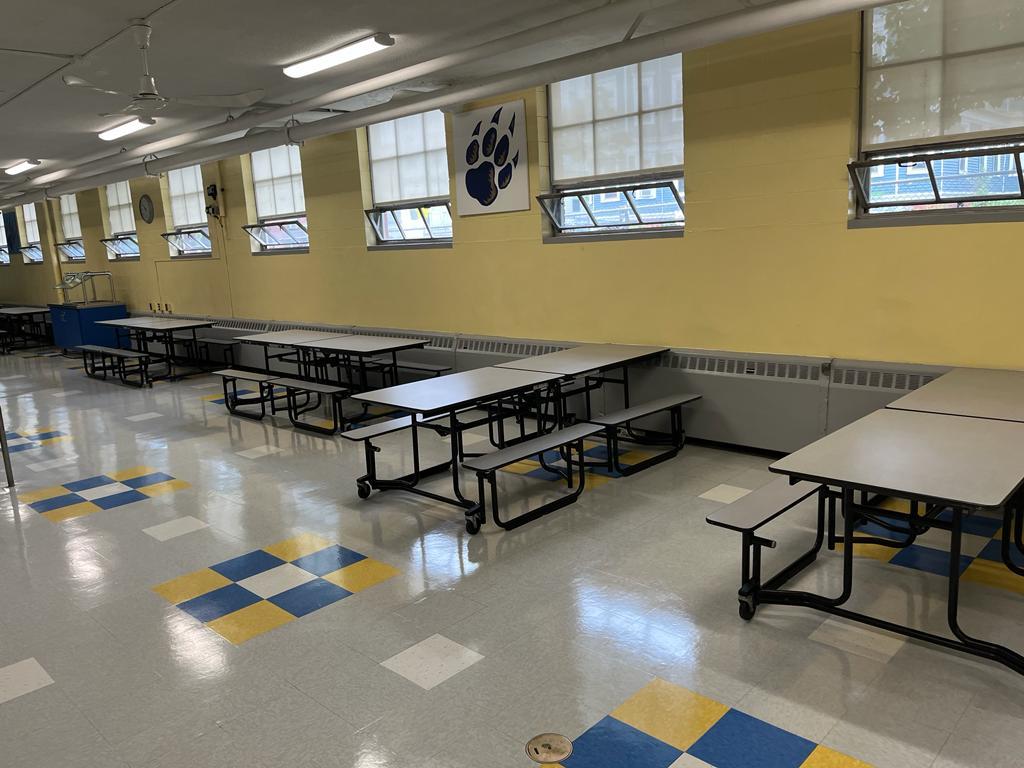 School cafeteria with freshly stripped and refinished VCT floor, cleaned by Miranda Shine Corp