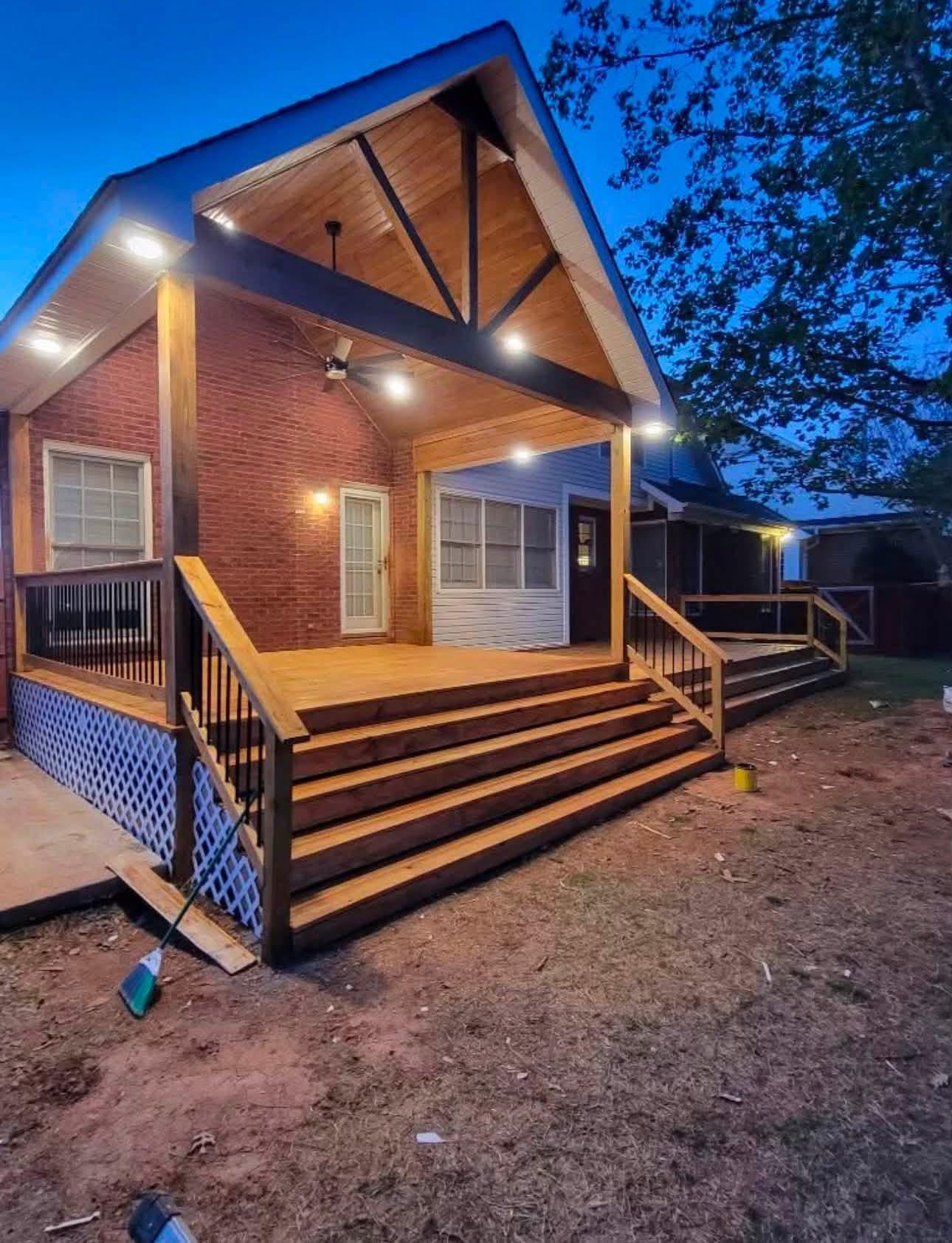 Covered wood deck with recessed lighting built by Morales Backyard Renovations in North Alabama