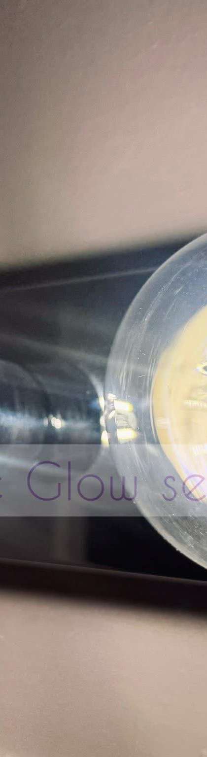 Before and after: dusty Edison bulbs wiped clear during a detail cleaning by Purple Glow Services