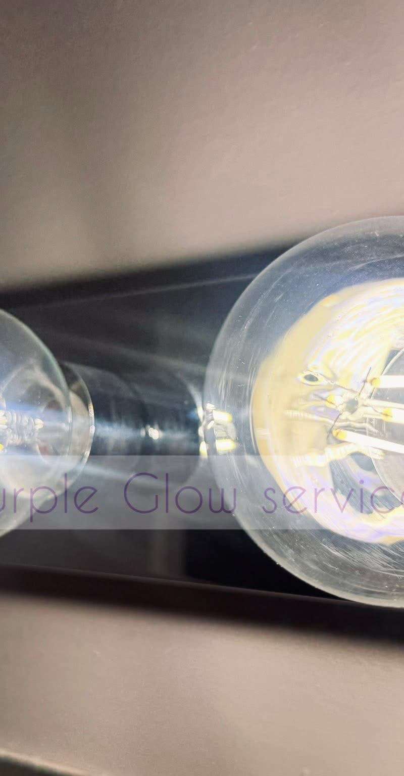 Before and after: dusty Edison bulbs wiped clear during a detail cleaning by Purple Glow Services