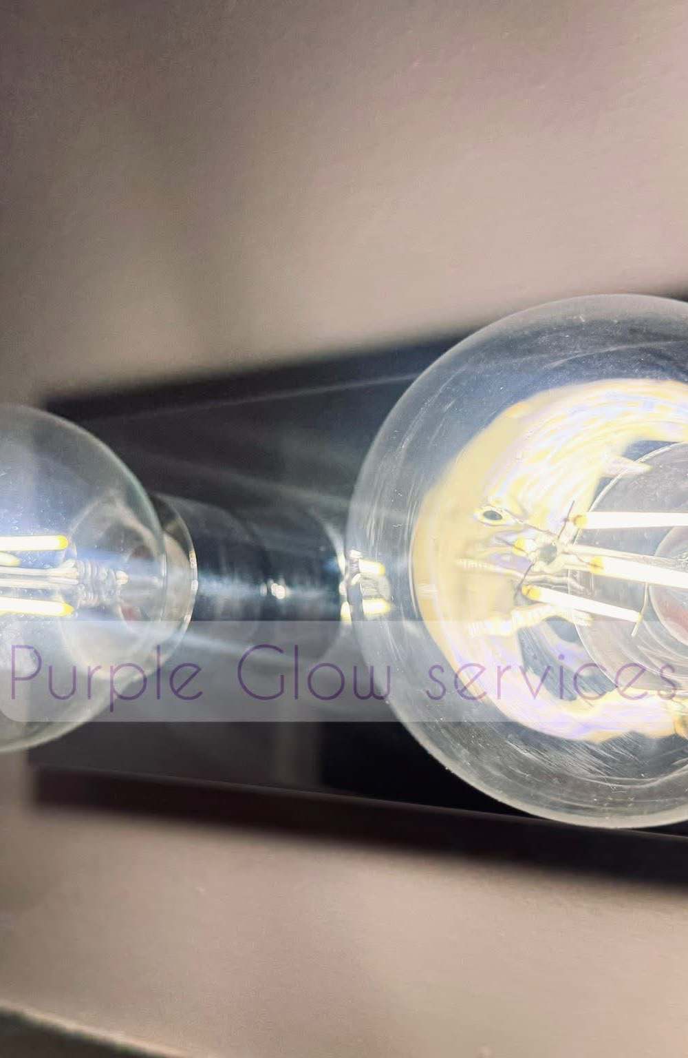 Before and after: dusty Edison bulbs wiped clear during a detail cleaning by Purple Glow Services