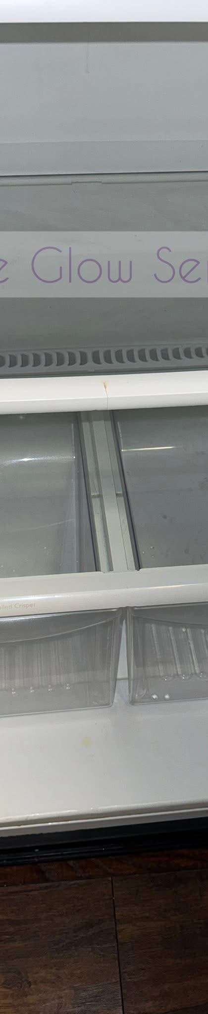 Empty refrigerator interior washed down with clean glass shelves during a move-out cleaning in Murfreesboro, TN