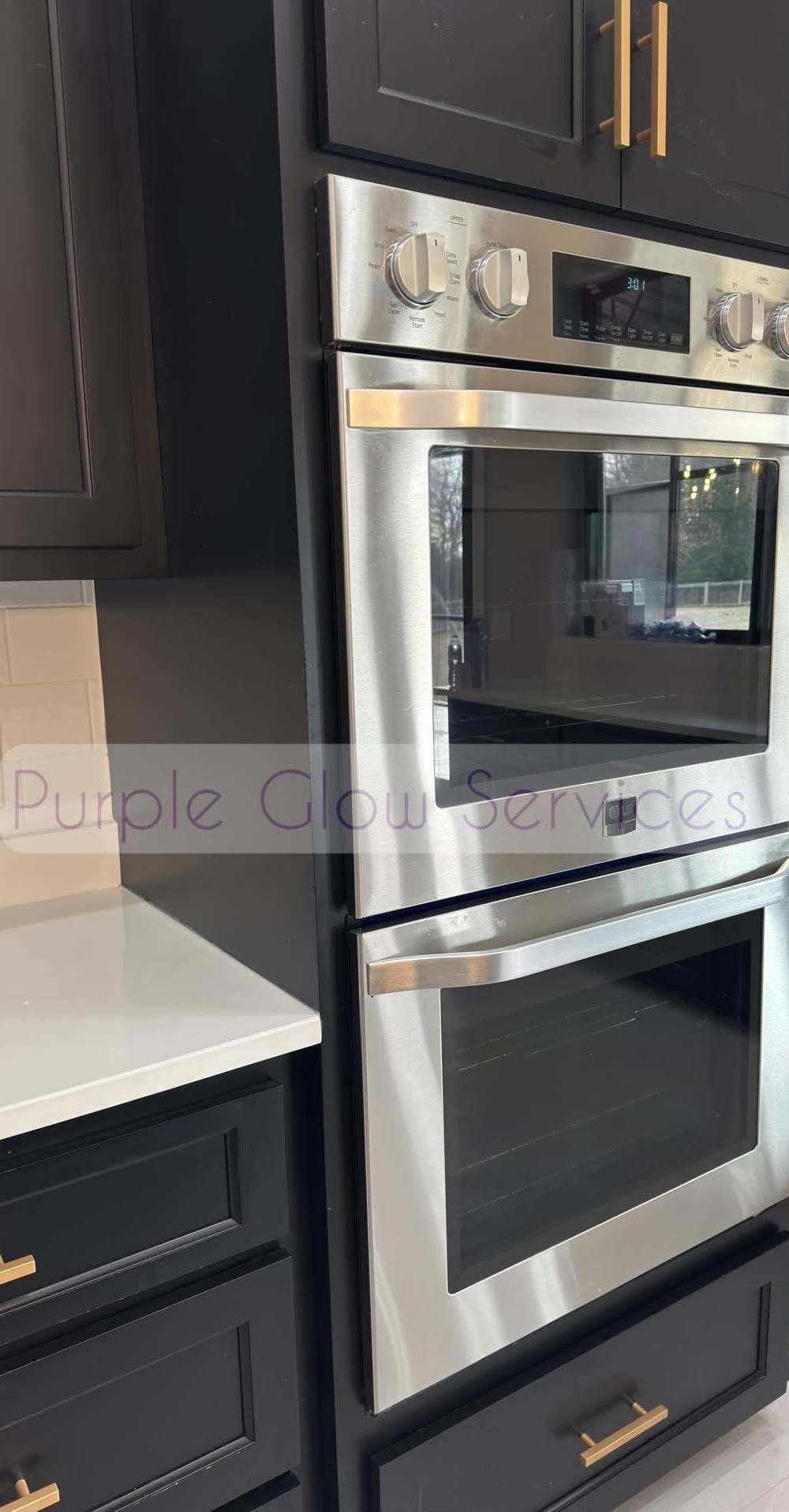 Stainless double wall oven and quartz countertop polished during a deep kitchen clean in Middle Tennessee