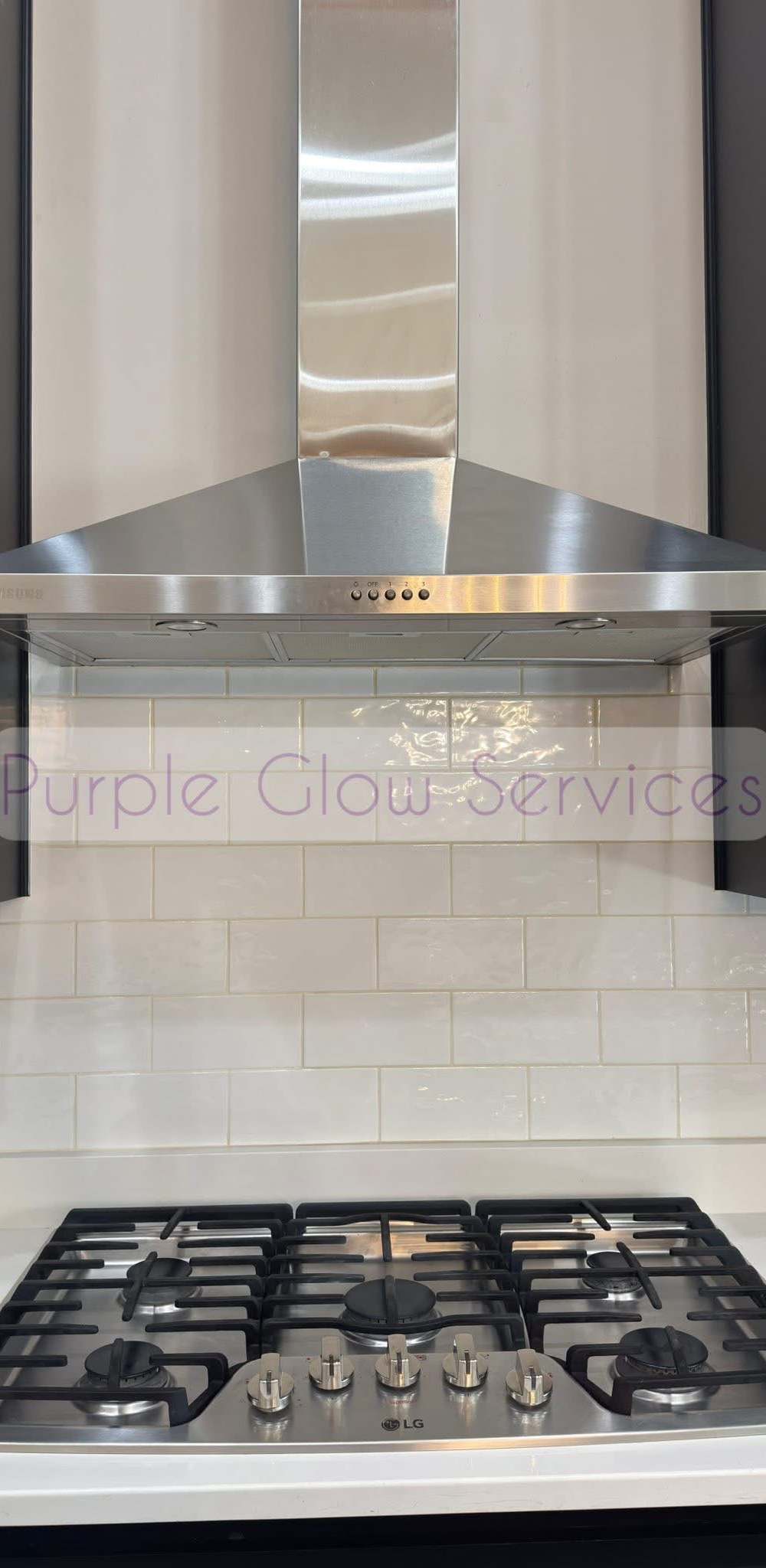 Stainless range hood, gas cooktop and white tile backsplash wiped down after a kitchen cleaning in Murfreesboro, TN