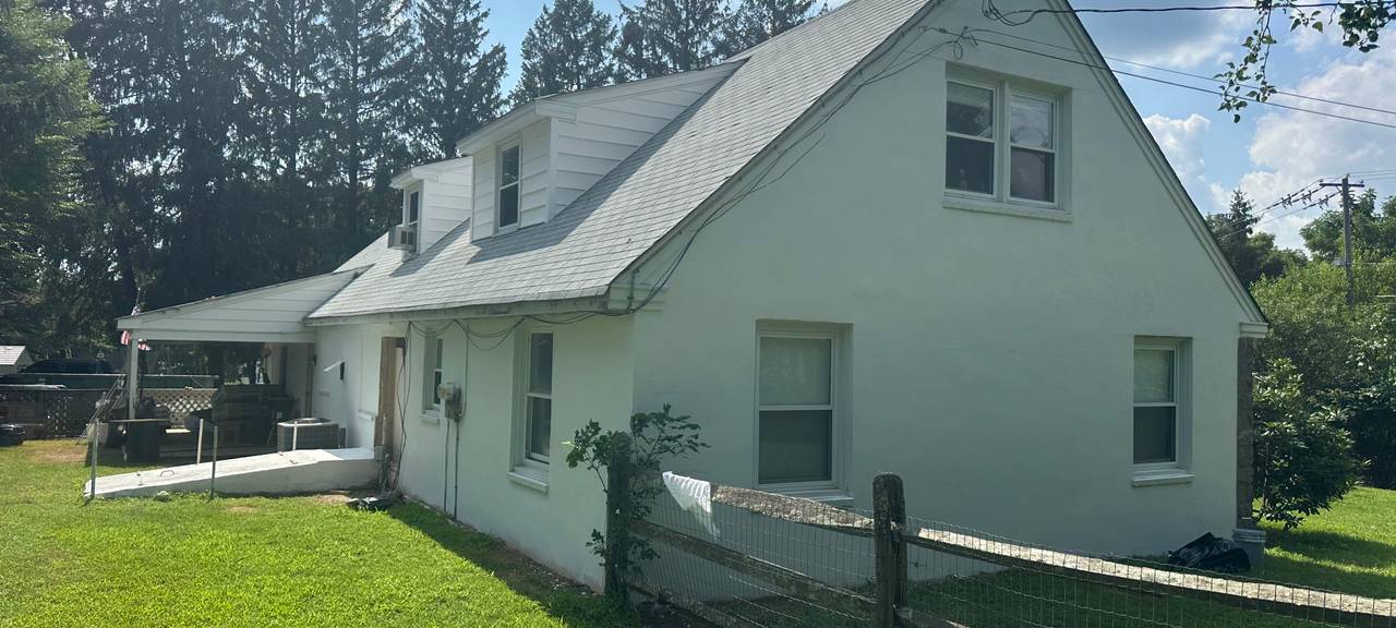 Freshly repainted house exterior completed by Roypainting Service LLC