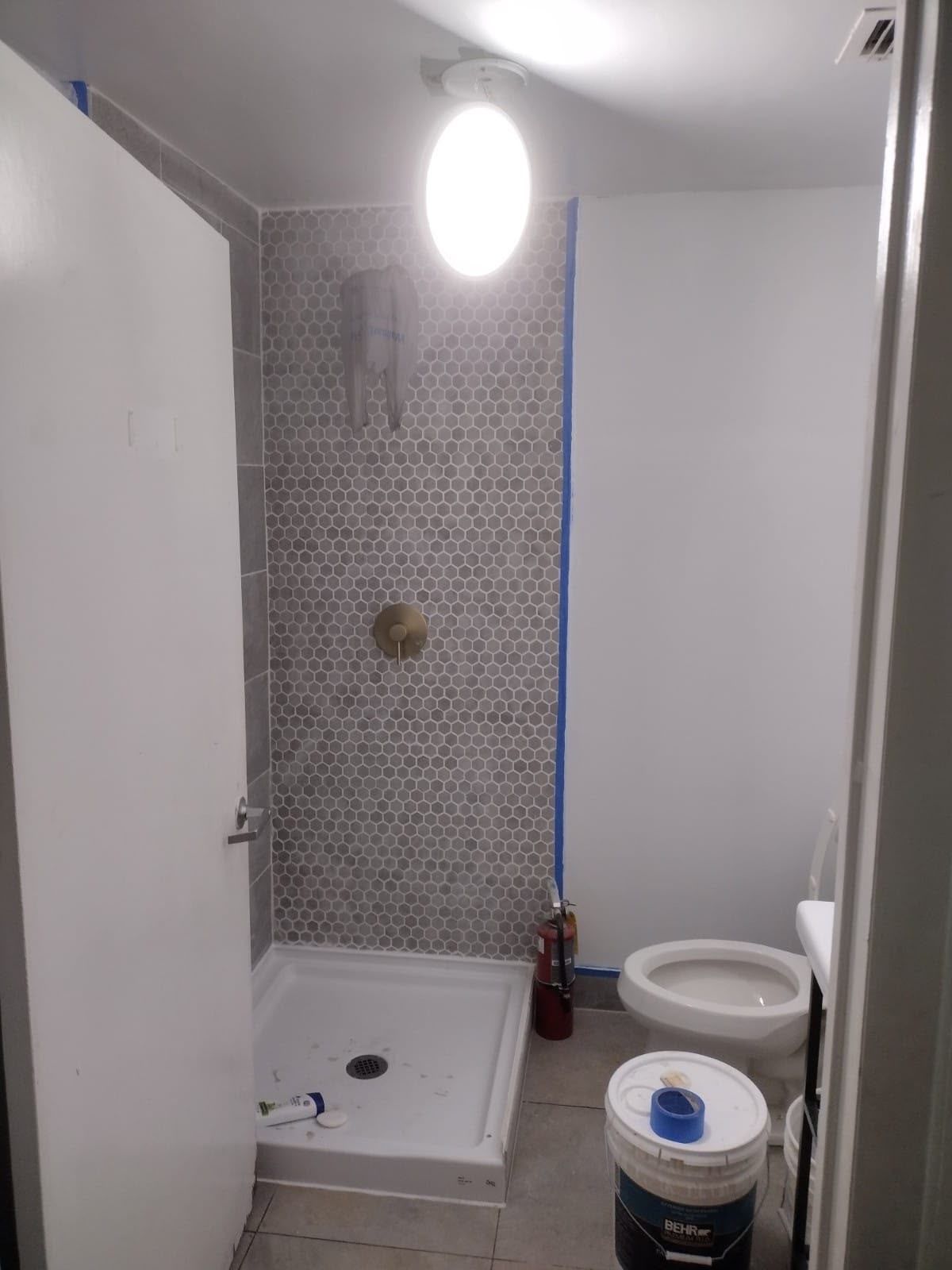 Tiled shower wall and new pan — Bathroom Remodel project by SoHo Home Multiservices