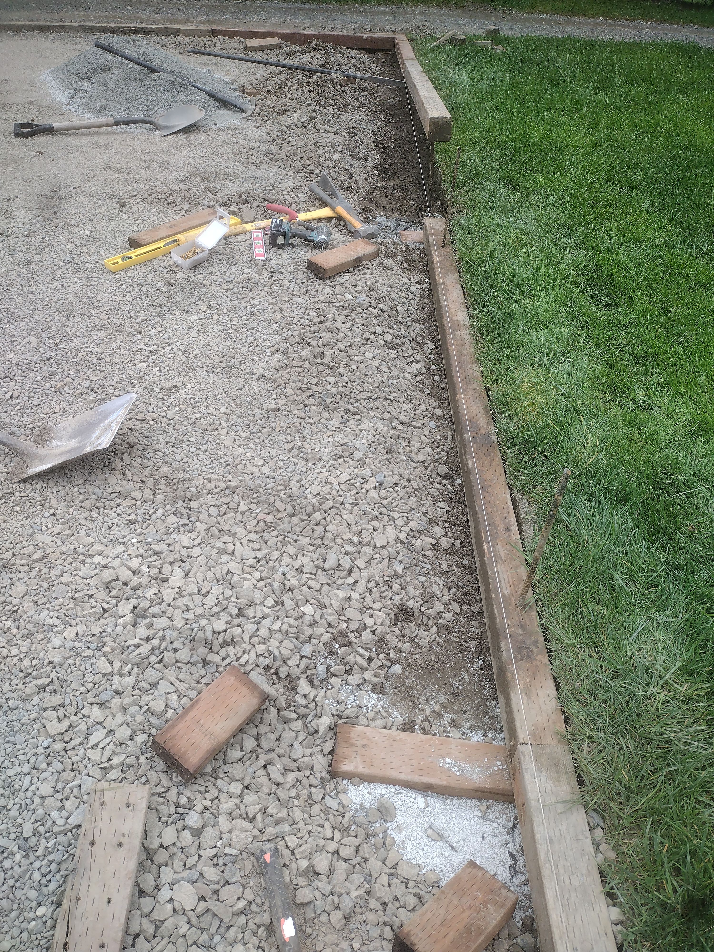 Compacted gravel base and forms ready for concrete