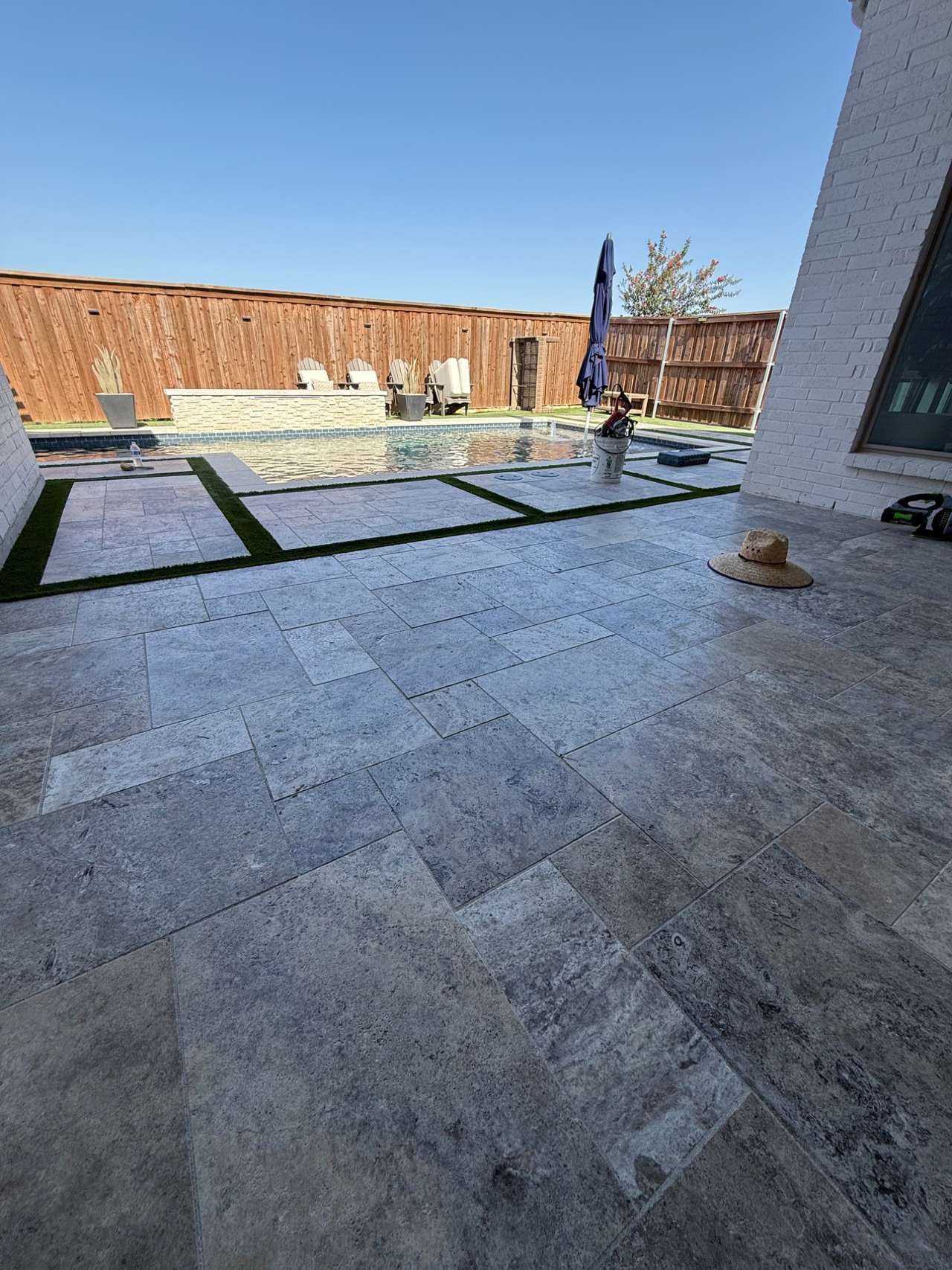 Travertine paver pool deck built by Txtop Hardscaping in Fort Worth, Texas