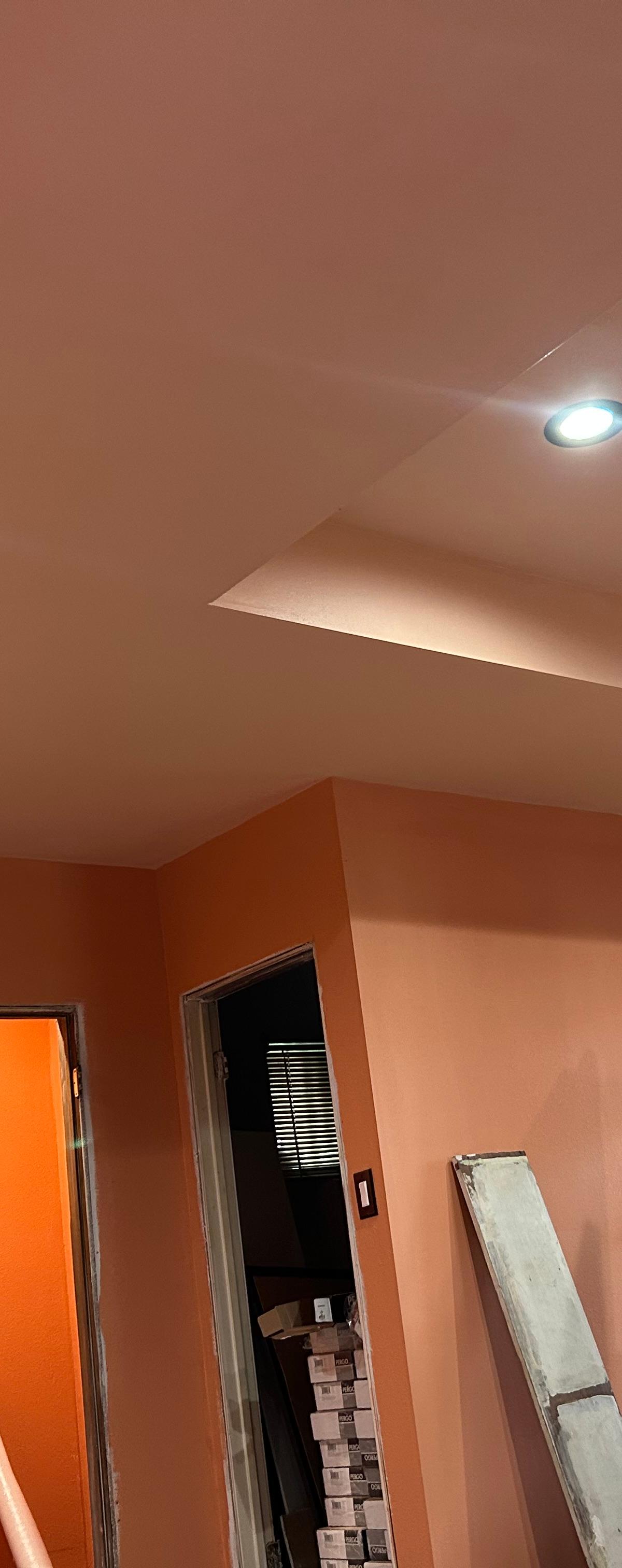 Interior repainted by WAR Construction with a tray ceiling and recessed lighting